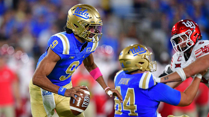 Aug 30, 2025; Pasadena, California, USA; UCLA Bruins quarterback Nico Iamaleava (9) runs the ball as offensive lineman Sam Yoon (64) provides coverage against Utah Utes linebacker Lander Barton (8) during the second half at Rose Bowl. Mandatory Credit: Gary A. Vasquez-Imagn Images Aug 30, 2025; Pasadena, California, USA; UCLA Bruins quarterback Nico Iamaleava (9) runs the ball as offensive lineman Sam Yoon (64) provides coverage against Utah Utes linebacker Lander Barton (8) during the second half at Rose Bowl. Mandatory Credit: Gary A. Vasquez-Imagn Images