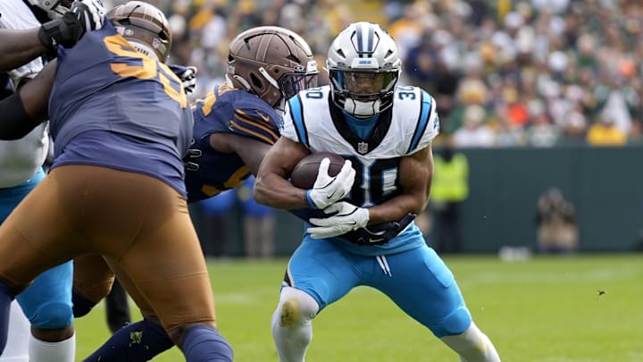 Nov 2, 2025; Green Bay, Wisconsin, USA; Carolina Panthers running back Chuba Hubbard (30) runs during the first half against the Green Bay Packers at Lambeau Field. Mandatory Credit: Jeff Hanisch-Imagn Images