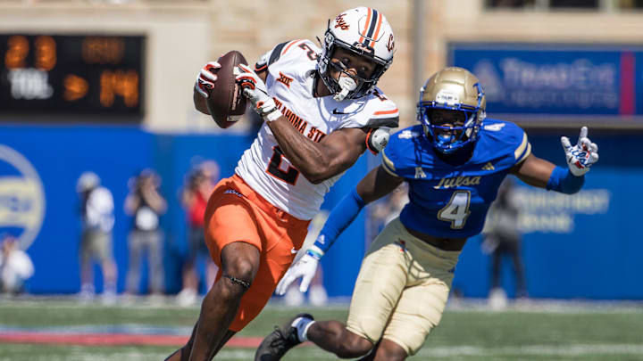 Sep 14, 2024; Tulsa, Oklahoma, USA; Oklahoma State Cowboys wide receiver Talyn Shettron (2) makes a reception against Tulsa Golden Hurricane cornerback Tyree Carlisle (4) during a game at Skelly Field at H.A. Chapman Stadium. Mandatory Credit: Brett Rojo-Imagn Images Sep 14, 2024; Tulsa, Oklahoma, USA; Oklahoma State Cowboys wide receiver Talyn Shettron (2) makes a reception against Tulsa Golden Hurricane cornerback Tyree Carlisle (4) during a game at Skelly Field at H.A. Chapman Stadium. Mandatory Credit: Brett Rojo-Imagn Images