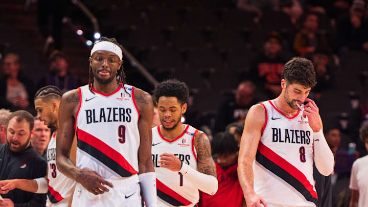 Dec 15, 2024; Phoenix, Arizona, USA; Portland Trail Blazers forward Jerami Grant (9), guard Anfernee Simons (1) and forward Deni Avdija (8) return to the court after a time out in the second half during a game against the Phoenix Suns at Footprint Center. Mandatory Credit: Allan Henry-Imagn Images