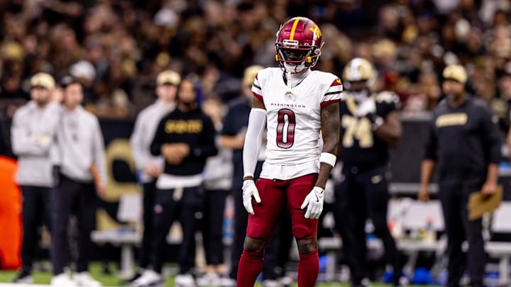 Dec 15, 2024; New Orleans, Louisiana, USA;  Washington Commanders cornerback Mike Sainristil (0) looks on against the New Orleans Saints during the first half at Caesars Superdome. Mandatory Credit: Stephen Lew-Imagn Images