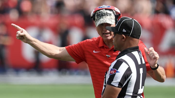 Nov 1, 2025; Houston, Texas, USA; Houston Cougars head coach Willie Fritz talks to an official while playing against the West Virginia Mountaineers in the second half at TDECU Stadium. Mandatory Credit: Thomas Shea-Imagn Images Nov 1, 2025; Houston, Texas, USA; Houston Cougars head coach Willie Fritz talks to an official while playing against the West Virginia Mountaineers in the second half at TDECU Stadium. Mandatory Credit: Thomas Shea-Imagn Images