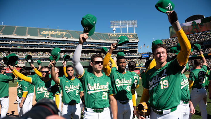 Sep 26, 2024; Oakland, California, USA; Oakland Athletics players tip their caps to the crowd after the game against the Texas Rangers at Oakland-Alameda County Coliseum. Mandatory Credit: Ed Szczepanski-Imagn Images Sep 26, 2024; Oakland, California, USA; Oakland Athletics players tip their caps to the crowd after the game against the Texas Rangers at Oakland-Alameda County Coliseum. Mandatory Credit: Ed Szczepanski-Imagn Images