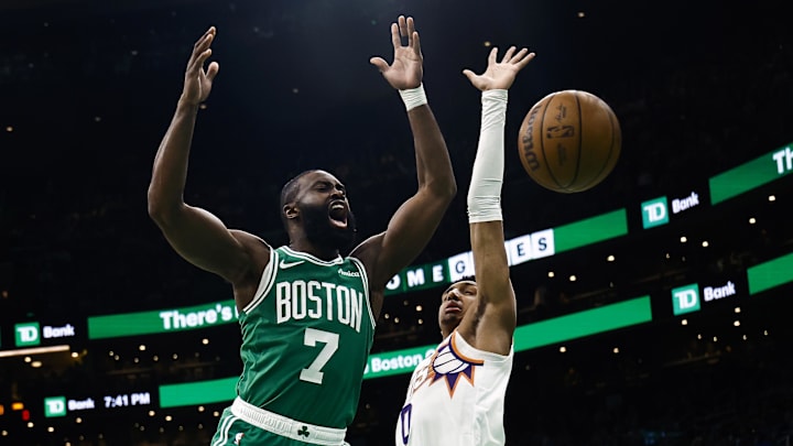 Apr 4, 2025; Boston, Massachusetts, USA; Boston Celtics guard Jaylen Brown (7) loses the ball against the defense of Phoenix Suns forward Ryan Dunn (0) during the first quarter at TD Garden. Mandatory Credit: Winslow Townson-Imagn Images