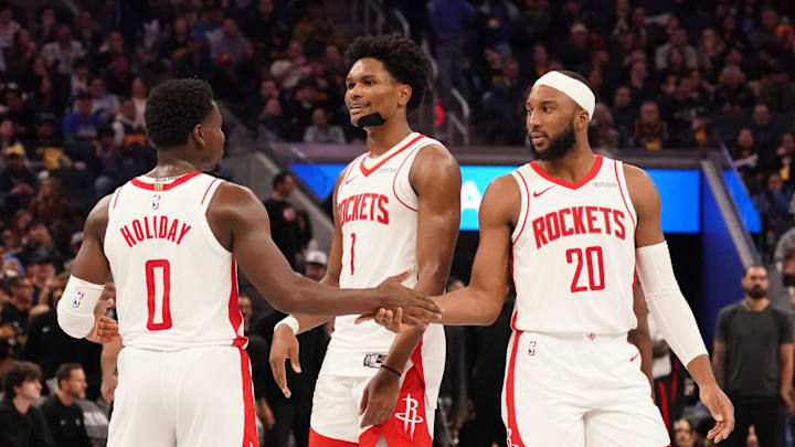 Nov 26, 2025; San Francisco, California, USA;  Houston Rockets guard Aaron Holiday (0), guard-forward Amen Thompson (1), and guard Josh Okogie (20) huddle during a break in the action against the Golden State Warriors in the fourth quarter at Chase Center. Mandatory Credit: David Gonzales-Imagn Images