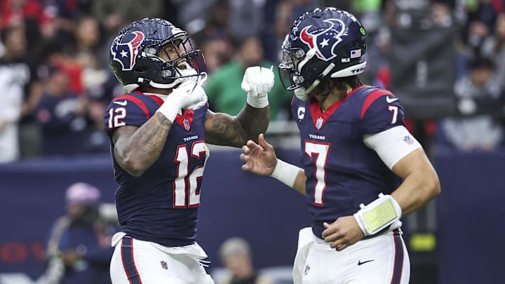 Jan 13, 2024; Houston, Texas, USA; Houston Texans wide receiver Nico Collins (12) celebrates with quarterback C.J. Stroud (7) after a touchdown in a 2024 AFC wild card game against the Cleveland Browns at NRG Stadium. Mandatory Credit: Troy Taormina-Imagn Images