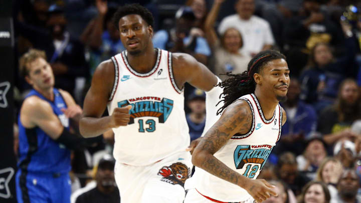 Oct 26, 2024; Memphis, Tennessee, USA; Memphis Grizzlies forward Jaren Jackson Jr. (13) and guard Ja Morant (12) get back on defense during the first half against the Orlando Magic at FedExForum. Mandatory Credit: Petre Thomas-Imagn Images