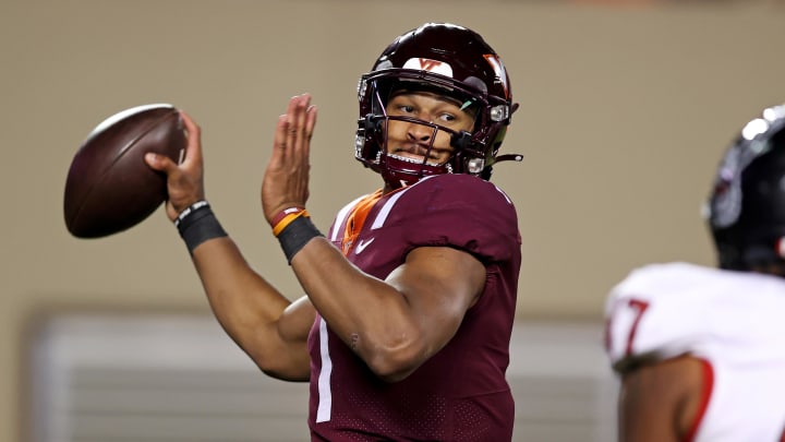 Nov 18, 2023; Blacksburg, Virginia, USA; Virginia Tech Hokies quarterback Kyron Drones (1) throws a pass against the North Carolina State Wolfpack at Lane Stadium. Mandatory Credit: Peter Casey-USA TODAY Sports