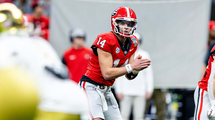 Jan 2, 2025; New Orleans, LA, USA;  Georgia Bulldogs quarterback Gunner Stockton (14) looks on against the Notre Dame Fighting Irish during the second half at Caesars Superdome. Mandatory Credit: Stephen Lew-Imagn Images
