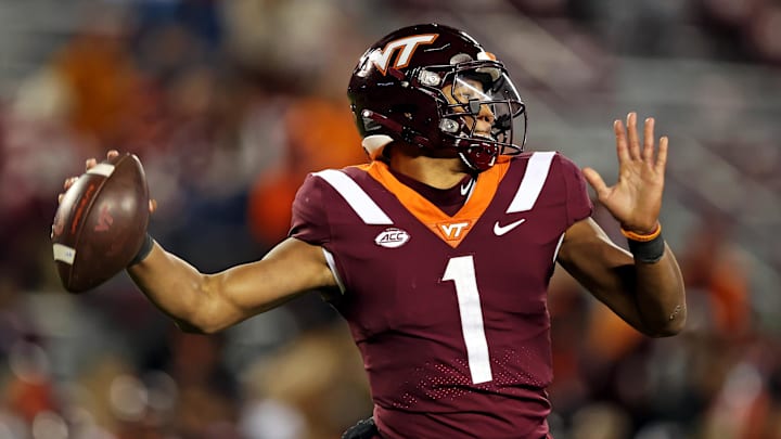 Nov 18, 2023; Blacksburg, Virginia, USA; Virginia Tech Hokies quarterback Kyron Drones (1) throws a pass against the North Carolina State Wolfpack at Lane Stadium. Mandatory Credit: Peter Casey-USA TODAY Sports