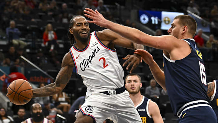 Oct 12, 2025; Inglewood, California, USA; Los Angeles Clippers forward Kawhi Leonard (2) passes the ball against Denver Nuggets center Nikola Jokić (15) during the first quarter at Intuit Dome. Mandatory Credit: Jonathan Hui-Imagn Images Oct 12, 2025; Inglewood, California, USA; Los Angeles Clippers forward Kawhi Leonard (2) passes the ball against Denver Nuggets center Nikola Jokić (15) during the first quarter at Intuit Dome. Mandatory Credit: Jonathan Hui-Imagn Images