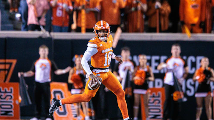 Oct 18, 2025; Stillwater, Oklahoma, USA; Oklahoma State Cowboys quarterback Sam Jackson V (18) looks to pass during the first half against the Cincinnati Bearcats at Boone Pickens Stadium. Mandatory Credit: William Purnell-Imagn Images Oct 18, 2025; Stillwater, Oklahoma, USA; Oklahoma State Cowboys quarterback Sam Jackson V (18) looks to pass during the first half against the Cincinnati Bearcats at Boone Pickens Stadium. Mandatory Credit: William Purnell-Imagn Images