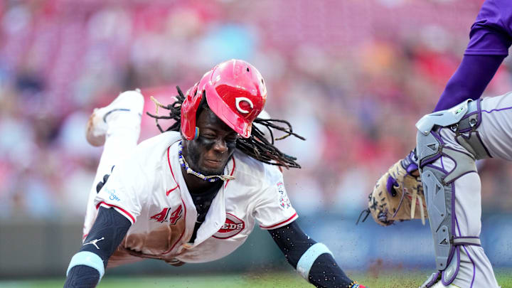 Cincinnati Reds shortstop Elly De La Cruz (44) dives across home plate on a steal attempt but is tagged out by Colorado Rockies catcher Elias Díaz (35) for the final out of the first inning of the MLB National League game between the Cincinnati Reds and the Colorado Rockies at Great American Ball Park in downtown Cincinnati on Monday, July 8, 2024. The score was 0-0 after three innings. Cincinnati Reds shortstop Elly De La Cruz (44) dives across home plate on a steal attempt but is tagged out by Colorado Rockies catcher Elias Díaz (35) for the final out of the first inning of the MLB National League game between the Cincinnati Reds and the Colorado Rockies at Great American Ball Park in downtown Cincinnati on Monday, July 8, 2024. The score was 0-0 after three innings.