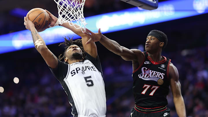 Mar 3, 2026; Philadelphia, Pennsylvania, USA; San Antonio Spurs guard Stephon Castle (5) drives for a shot against Philadelphia 76ers guard Vj Edgecombe (77) during the first quarter at Xfinity Mobile Arena. Mandatory Credit: Bill Streicher-Imagn Images Mar 3, 2026; Philadelphia, Pennsylvania, USA; San Antonio Spurs guard Stephon Castle (5) drives for a shot against Philadelphia 76ers guard Vj Edgecombe (77) during the first quarter at Xfinity Mobile Arena. Mandatory Credit: Bill Streicher-Imagn Images