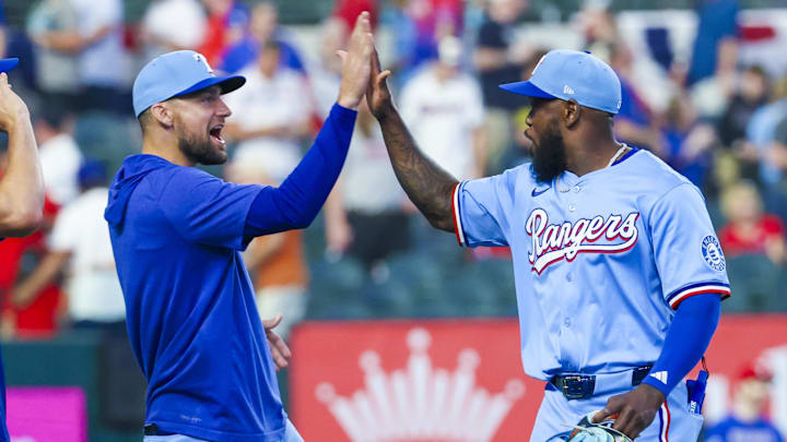 Mar 30, 2025; Arlington, Texas, USA; Texas Rangers right fielder Adolis Garcia (53) celebrates with Texas Rangers starting pitcher Nathan Eovaldi (17) after the game against the Boston Red Sox at Globe Life Field.