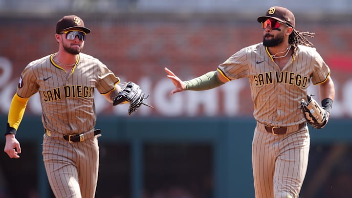 May 24, 2025; Atlanta, Georgia, USA; San Diego Padres right fielder Fernando Tatis Jr. (23) celebrates after a catch with center fielder Jackson Merrill (3) against the Atlanta Braves in the first inning at Truist Park. Mandatory Credit: Brett Davis-Imagn Images May 24, 2025; Atlanta, Georgia, USA; San Diego Padres right fielder Fernando Tatis Jr. (23) celebrates after a catch with center fielder Jackson Merrill (3) against the Atlanta Braves in the first inning at Truist Park. Mandatory Credit: Brett Davis-Imagn Images