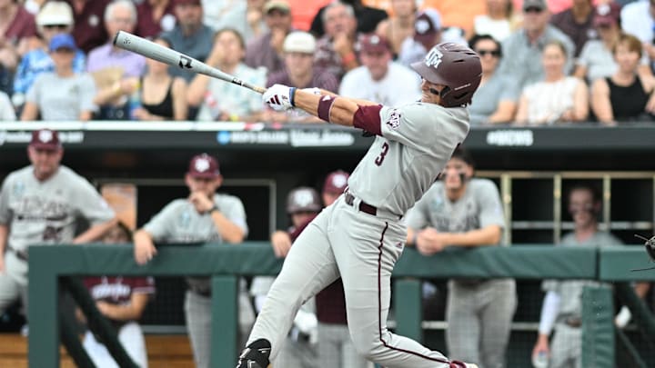 Jun 22, 2024; Omaha, NE, USA;  Texas A&M Aggies second baseman Kaeden Kent (3) drives in two runs with a single against the Tennessee Volunteers during the third inning at Charles Schwab Field Omaha. Mandatory Credit: Steven Branscombe-Imagn Images