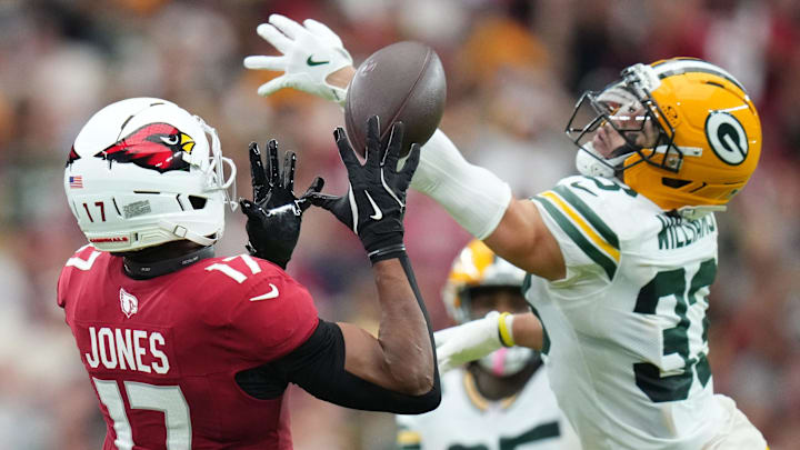 Arizona Cardinals receiver Zay Jones (17) catches a pass as Green Bay Packers safety Evan Williams (33) defends at State Farm Stadium in Glendale on Oct. 19, 2025. Arizona Cardinals receiver Zay Jones (17) catches a pass as Green Bay Packers safety Evan Williams (33) defends at State Farm Stadium in Glendale on Oct. 19, 2025.