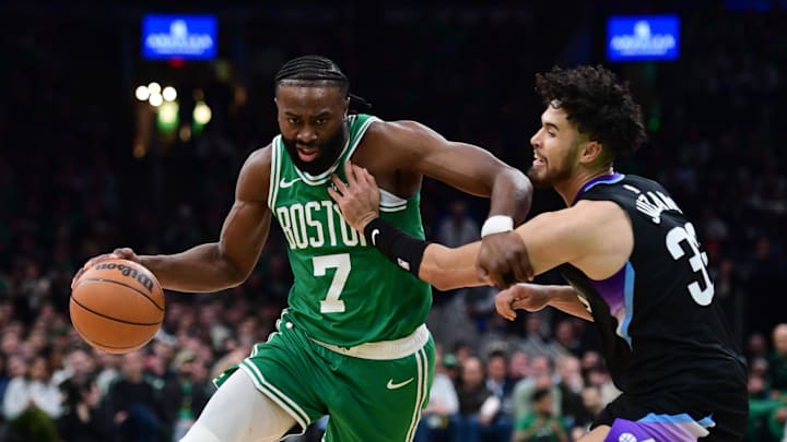 Mar 10, 2025; Boston, Massachusetts, USA; Boston Celtics guard Jaylen Brown (7) controls the ball while Utah Jazz guard Johnny Juzang (33) defends during the first half at TD Garden. Mandatory Credit: Bob DeChiara-Imagn Images