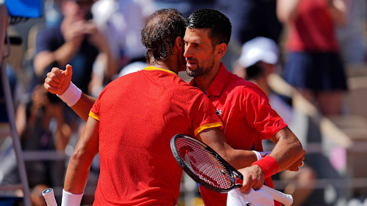 Novak Djokovic (SRB) shakes hands with Rafael Nadal (ESP) after their match in the men’s tennis sinlges first round during the Paris 2024 Olympic Summer Games at Stade Roland Garros. Mandatory Credit: Amber Searls-Imagn Images
