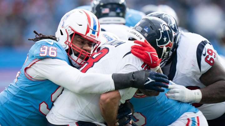 Tennessee Titans defensive end Denico Autry (96) sacks Houston Texans quarterback Case Keenum (18) during their game at Nissan Stadium in Nashville, Tenn., Sunday, Dec. 17, 2023. Tennessee Titans defensive end Denico Autry (96) sacks Houston Texans quarterback Case Keenum (18) during their game at Nissan Stadium in Nashville, Tenn., Sunday, Dec. 17, 2023.