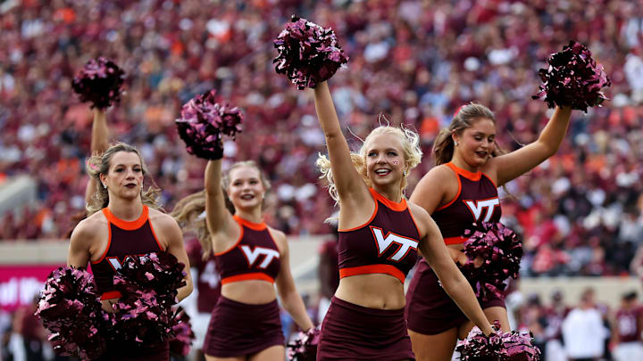 Oct 26, 2024; Blacksburg, Virginia, USA; Virginia Tech Hokies cheerleaders run off the field after a time out of the game between the Virginia Tech Hokies and the Georgia Tech Yellow Jackets at Lane Stadium. Mandatory Credit: Peter Casey-Imagn Images Oct 26, 2024; Blacksburg, Virginia, USA; Virginia Tech Hokies cheerleaders run off the field after a time out of the game between the Virginia Tech Hokies and the Georgia Tech Yellow Jackets at Lane Stadium. Mandatory Credit: Peter Casey-Imagn Images