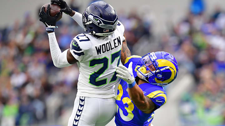 Dec 4, 2022; Inglewood, California, USA; Seattle Seahawks cornerback Tariq Woolen (27) intercepts a pass intended for Los Angeles Rams running back Kyren Williams (23) during the first half at SoFi Stadium. Mandatory Credit: Gary A. Vasquez-Imagn Images