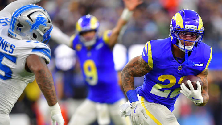 Dec 14, 2025; Inglewood, California, USA; Los Angeles Rams running back Blake Corum (22) runs the ball during the third quarter against the Detroit Lions at SoFi Stadium. Mandatory Credit: Gary A. Vasquez-Imagn Images