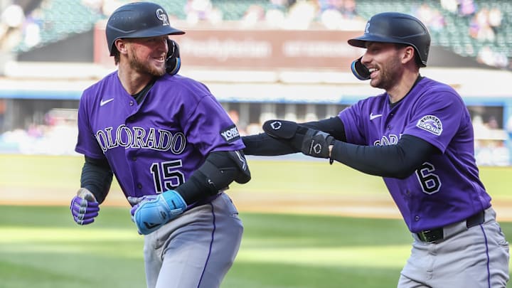 Colorado Rockies catcher Hunter Goodman (15) celebrates with second baseman Edouard Julien (6) after hitting a two run home run. 