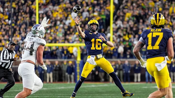 Michigan quarterback Davis Warren (16) makes a pass to tight end Marlin Klein (17) against Oregon during the second half at Michigan Stadium in Ann Arbor on Saturday, Nov. 2, 2024.