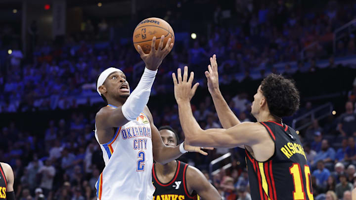 Oct 27, 2024; Oklahoma City, Oklahoma, USA; Oklahoma City Thunder guard Shai Gilgeous-Alexander (2) shoots against Atlanta Hawks forward Zaccharie Risacher (10) during the second half at Paycom Center. Mandatory Credit: Alonzo Adams-Imagn Images