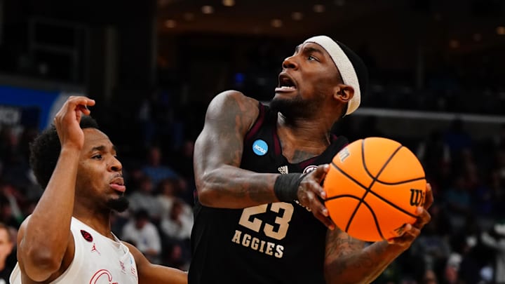 Mar 24, 2024; Memphis, TN, USA; Texas A&M Aggies guard Tyrece Radford (23) controls the ball against Houston Cougars guard L.J. Cryer (4) in the first half in the second round of the 2024 NCAA Tournament at FedExForum. Mandatory Credit: John David Mercer-Imagn Images