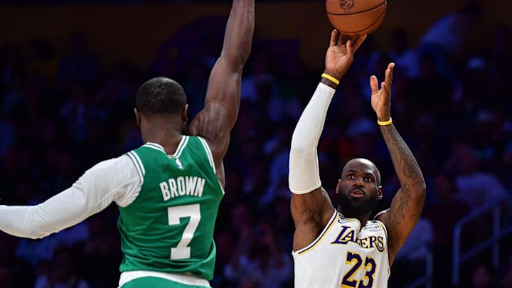 Feb 22, 2026; Los Angeles, California, USA; Los Angeles Lakers forward LeBron James (23) shoots against Boston Celtics guard Jaylen Brown (7) during the second half at Crypto.com Arena. Mandatory Credit: Gary A. Vasquez-Imagn Images