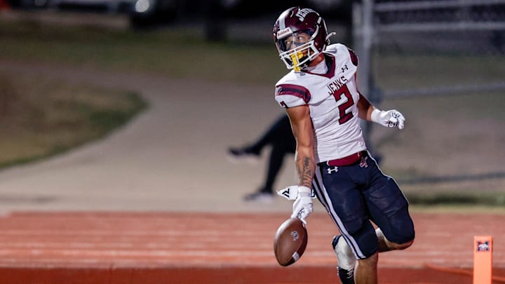 Jenks’ Kaydin Jones (2) runs the ball for a touchdown during a high school football game between Mustang and Jenks in Mustang, Okla., on Friday, Oct. 11, 2024. Jenks’ Kaydin Jones (2) runs the ball for a touchdown during a high school football game between Mustang and Jenks in Mustang, Okla., on Friday, Oct. 11, 2024.
