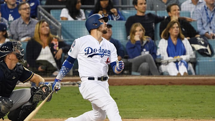 Oct 15, 2018; Los Angeles, CA, USA; Los Angeles Dodgers catcher Yasmani Grandal (9) hits a double against the Milwaukee Brewers in the fifth inning in game three of the 2018 NLCS playoff baseball series at Dodger Stadium. Mandatory Credit: Robert Hanashiro-Imagn Images Oct 15, 2018; Los Angeles, CA, USA; Los Angeles Dodgers catcher Yasmani Grandal (9) hits a double against the Milwaukee Brewers in the fifth inning in game three of the 2018 NLCS playoff baseball series at Dodger Stadium. Mandatory Credit: Robert Hanashiro-Imagn Images
