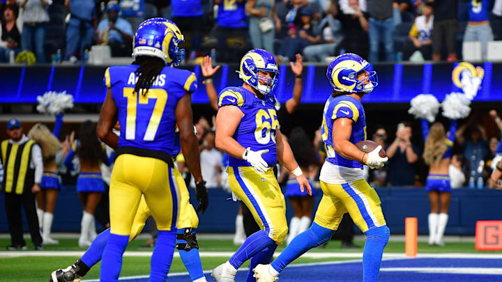 Sep 28, 2025; Inglewood, California, USA; Los Angeles Rams wide receiver Puka Nacua (12) celebrates his touchdown scored against the Indianapolis Colts with center Coleman Shelton (65) and wide receiver Davante Adams (17) during the second half at SoFi Stadium. Mandatory Credit: Gary A. Vasquez-Imagn Images Sep 28, 2025; Inglewood, California, USA; Los Angeles Rams wide receiver Puka Nacua (12) celebrates his touchdown scored against the Indianapolis Colts with center Coleman Shelton (65) and wide receiver Davante Adams (17) during the second half at SoFi Stadium. Mandatory Credit: Gary A. Vasquez-Imagn Images
