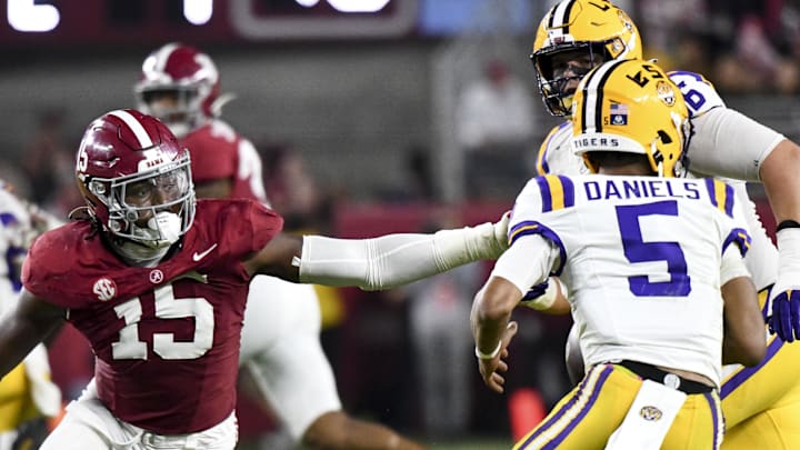 Nov 4, 2023; Tuscaloosa, Alabama, USA;  LSU Tigers quarterback Jayden Daniels (5) escapes the pass