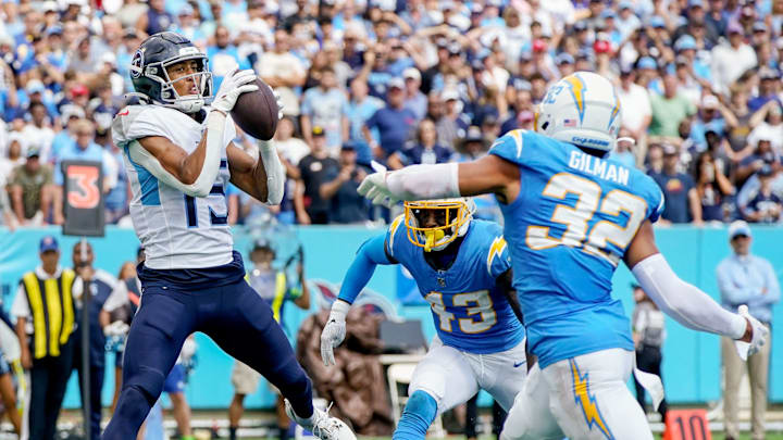 Tennessee Titans wide receiver Nick Westbrook-Ikhine (15) brings in a touchdown past Los Angeles Chargers cornerback Michael Davis (43) and safety Alohi Gilman (32) in 2023. Tennessee Titans wide receiver Nick Westbrook-Ikhine (15) brings in a touchdown past Los Angeles Chargers cornerback Michael Davis (43) and safety Alohi Gilman (32) in 2023.