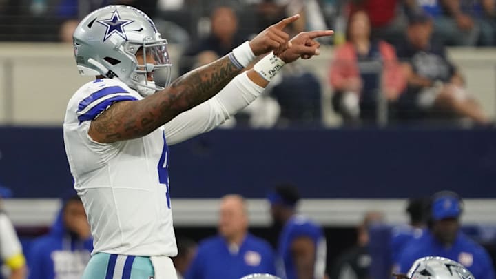 Sep 14, 2025; Arlington, Texas, USA; Dallas Cowboys quarterback Dak Prescott (4) signals to teammates before a snap against the New York Giants during the first quarter at AT&T Stadium. Mandatory Credit: Raymond Carlin III-Imagn Images