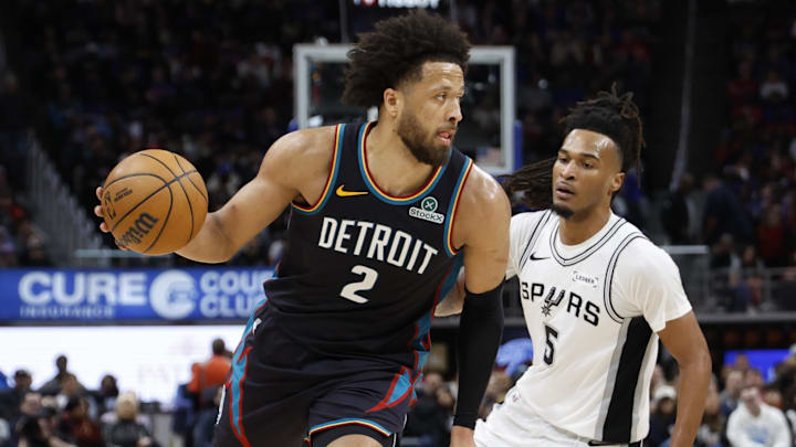 Feb 23, 2026; Detroit, Michigan, USA;  Detroit Pistons guard Cade Cunningham (2) dribbles on San Antonio Spurs guard Stephon Castle (5) in the second half at Little Caesars Arena. Mandatory Credit: Rick Osentoski-Imagn Images