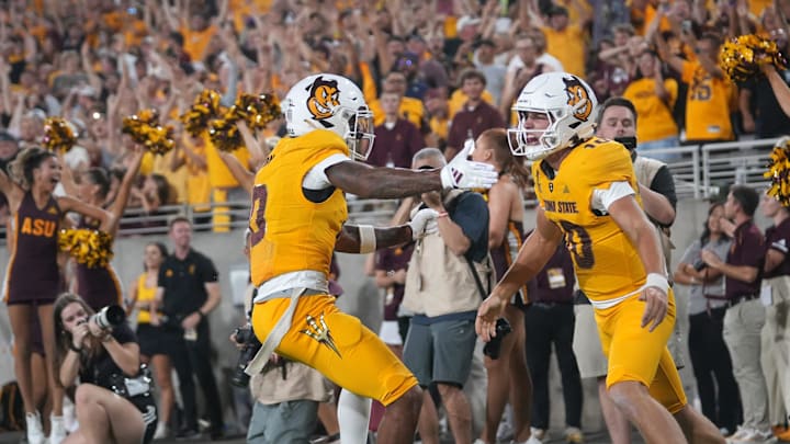 Arizona State quarterback Sam Leavitt (10) celebrates his touchdown run with teammate Jordyn Tyson (0) Jordyn Tyson against the Mississippi State Bulldogs at Mountain America Stadium in Tempe on Sept. 7, 2024. Arizona State quarterback Sam Leavitt (10) celebrates his touchdown run with teammate Jordyn Tyson (0) Jordyn Tyson against the Mississippi State Bulldogs at Mountain America Stadium in Tempe on Sept. 7, 2024.