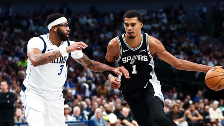 Oct 22, 2025; Dallas, Texas, USA;   San Antonio Spurs forward Victor Wembanyama (1) drives to the basket as Dallas Mavericks forward Anthony Davis (3) defends during the second half at American Airlines Center. Mandatory Credit: Kevin Jairaj-Imagn Images