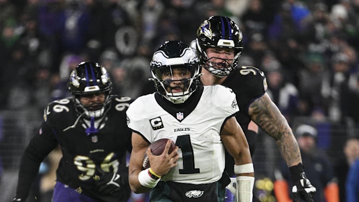 Dec 1, 2024; Baltimore, Maryland, USA; Philadelphia Eagles quarterback Jalen Hurts (1) rushes during the second  half  against the Baltimore Ravens at M&T Bank Stadium. 
