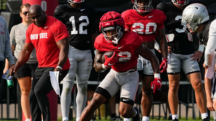 Aug 8, 2024; Columbus, Ohio, USA; Ohio State Buckeyes running back TreVeyon Henderson (32) runs during football practice at the Woody Hayes Athletic Complex.