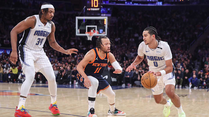 Orlando Magic guard Anthony Black looks to drive past New York Knicks guard Jalen Brunson.