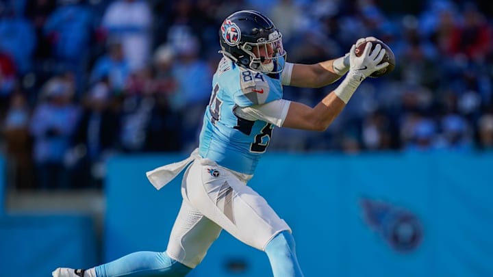 Tennessee Titans tight end Gunnar Helm (84) receives a pass during the third quarter against the Jacksonville Jaguars at Nissan Stadium in Nashville, Tenn., Sunday, Nov. 30, 2025.