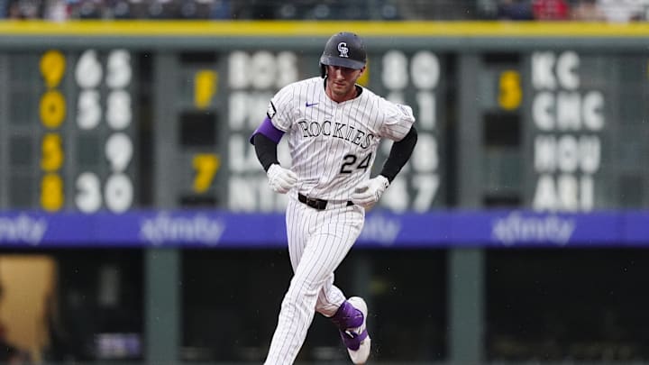 Jul 22, 2025; Denver, Colorado, USA;Colorado Rockies third baseman Ryan McMahon (24) runs off a three run home run in the fourth inning against the St. Louis Cardinals at Coors Field. Mandatory Credit: Ron Chenoy-Imagn Images