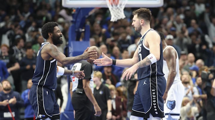 Dec 3, 2024; Dallas, Texas, USA;  Dallas Mavericks guard Kyrie Irving (11) celebrates with Dallas Mavericks guard Luka Doncic (77) during the fourth quarter against the Memphis Grizzlies at American Airlines Center. Mandatory Credit: Kevin Jairaj-Imagn Images