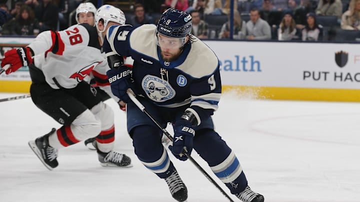 Dec 19, 2024; Columbus, Ohio, USA; Columbus Blue Jackets defenseman Ivan Provorov (9) carries the puck as New Jersey Devils right wing Timo Meier (28) trails the play during the third period at Nationwide Arena. Mandatory Credit: Russell LaBounty-Imagn Images