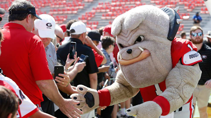 Georgia mascot Hairy Dawg slaps hands with to fans before the start of a NCAA college football game against Auburn in Athens, Ga., on Saturday, Oct. 5, 2024. Georgia mascot Hairy Dawg slaps hands with to fans before the start of a NCAA college football game against Auburn in Athens, Ga., on Saturday, Oct. 5, 2024.